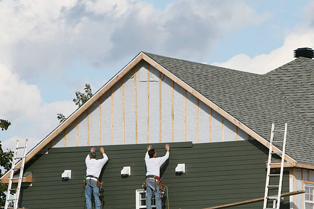Professional Storm Damage Siding Repair technician working in Bloomington, MN
